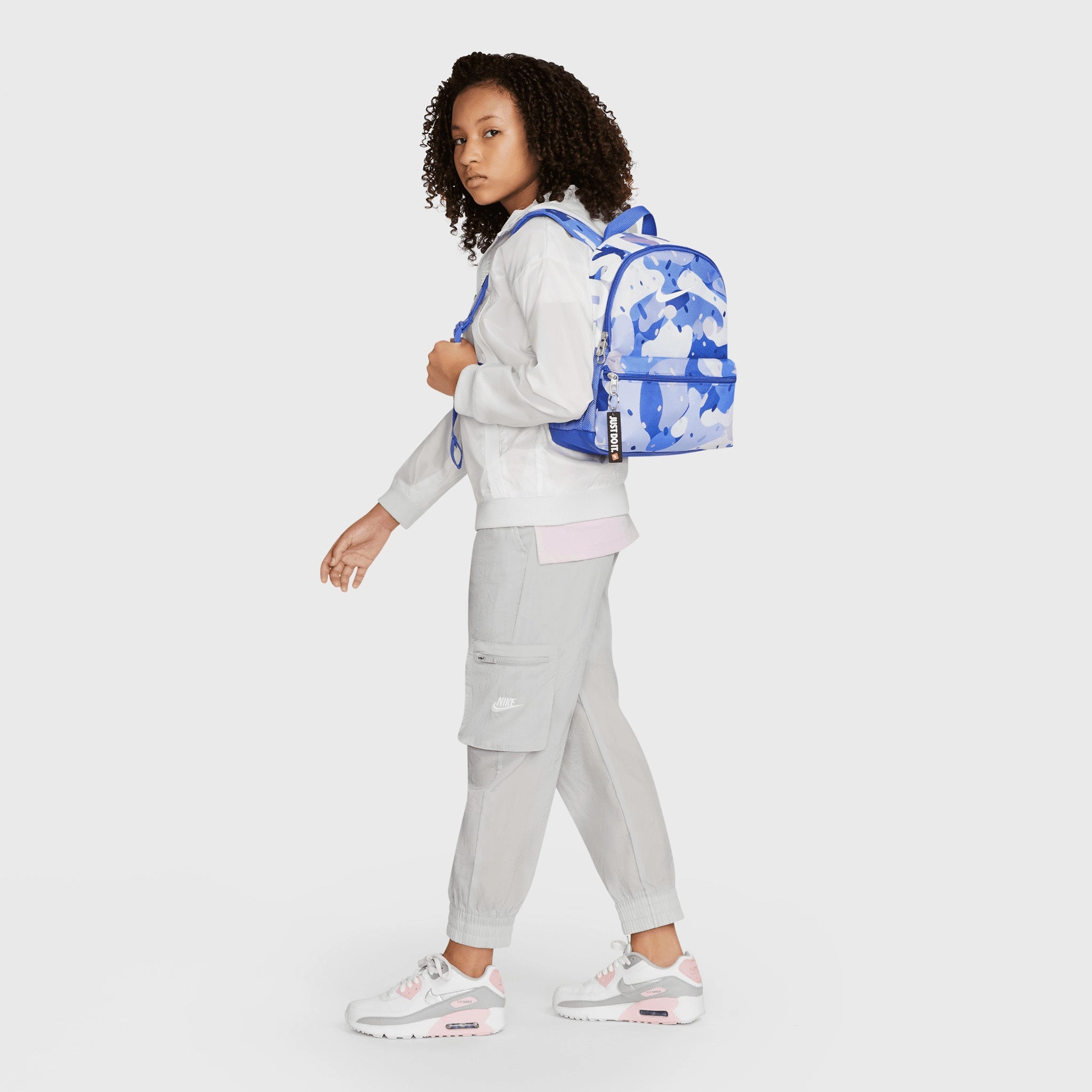 Nike Kids' Brasilia JDI Printed Mini Backpack Comet Blue / Light Thistle - White